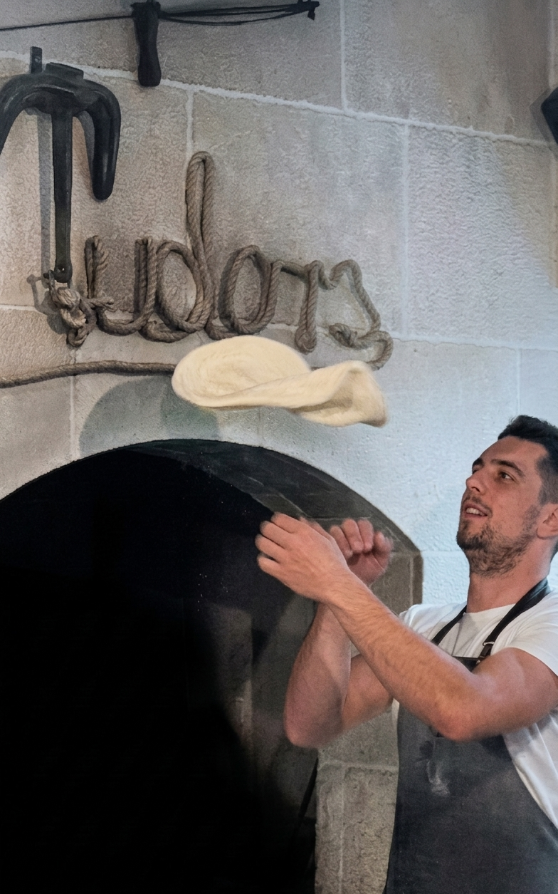 Pizzaiolo preparing pizza at Tudors in Split